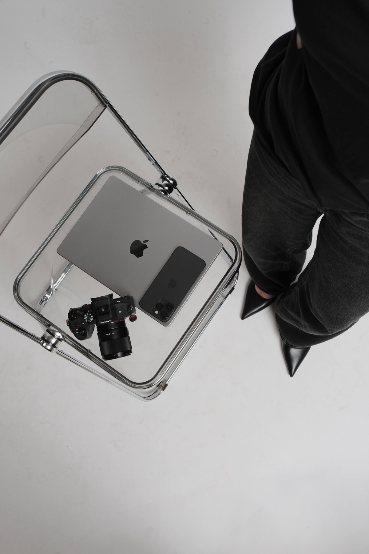 Laptop, camera and bag laid out