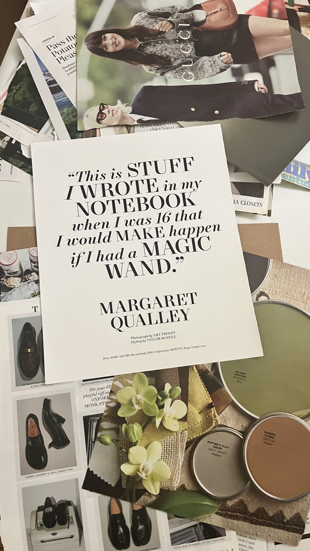 Magazine tear sheets and objects laid out