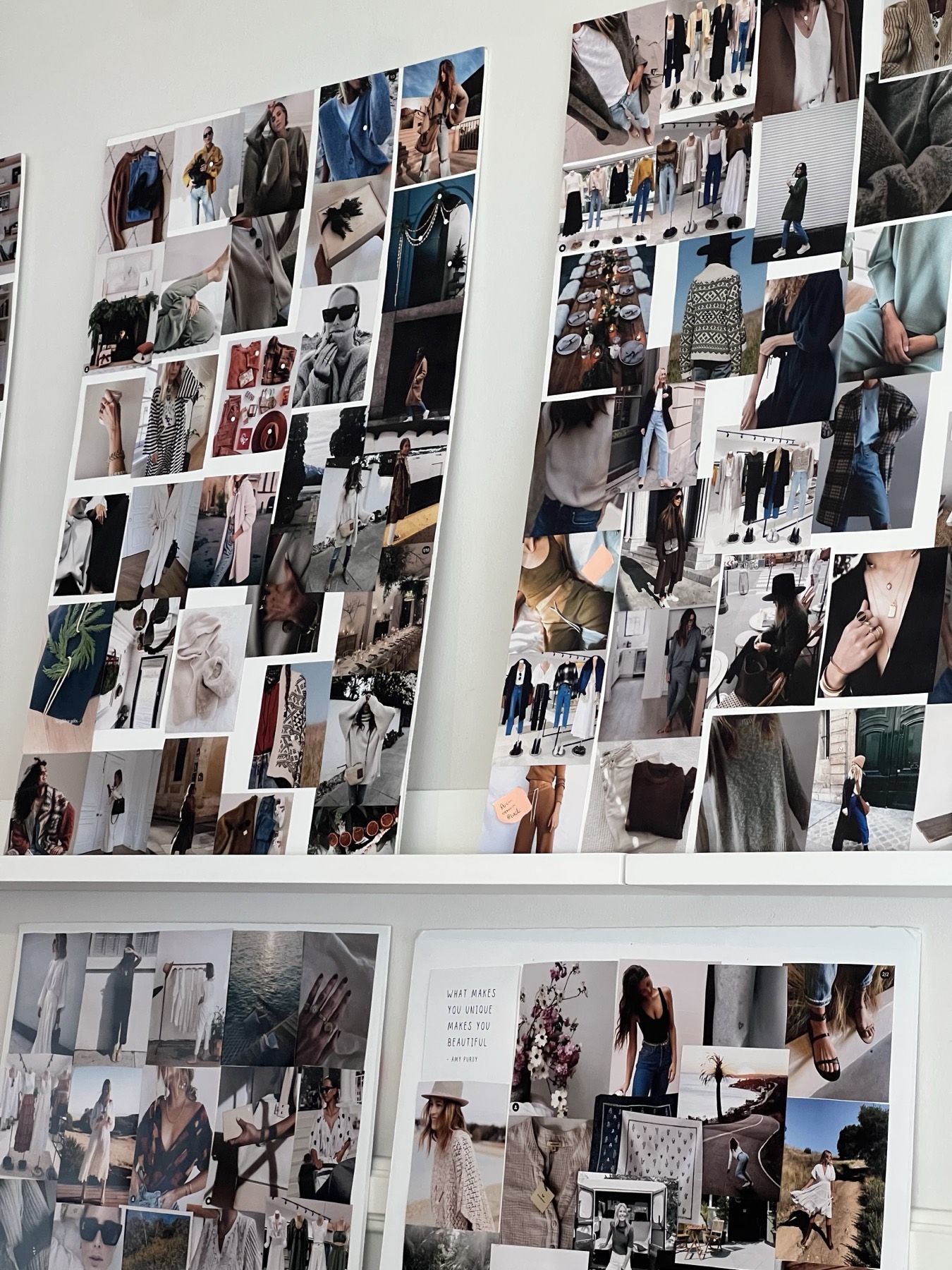 Printed mood boards lined up on shelves